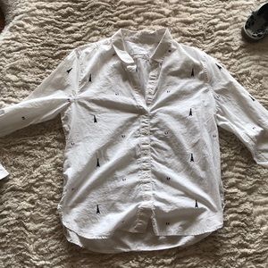 White blouse size large from equipment. Has Eiffel towers on it